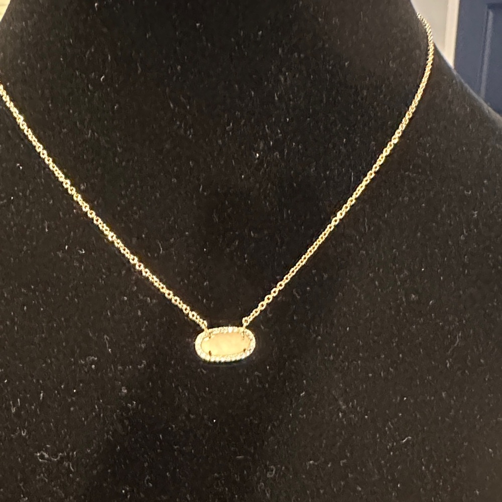 Dainty Goldtone Necklace with cream colored gemstone & crystals surrounding